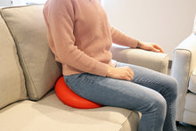 Load image into Gallery viewer, person sitting on the rubber ring on the couch