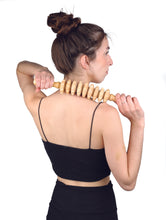 Load image into Gallery viewer, massage roller pin being used on a sholder
