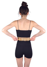 Load image into Gallery viewer, massage roller pin being used on a lower back
