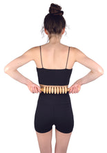 Load image into Gallery viewer, massage roller pin being used on a lower back