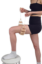Load image into Gallery viewer, wooden rope massager used on the back of a persons thigh