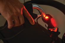 Load image into Gallery viewer, LED light on a bake handle of a walker lit up in red
