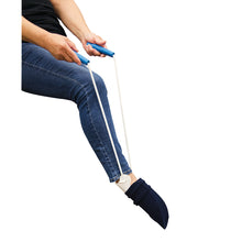 Load image into Gallery viewer, sock aid in use, pulling up a sock onto a foot
