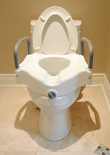 Load image into Gallery viewer, Raised Toilet Seat with Handles attached to a toilet
