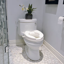 Load image into Gallery viewer, Raided Toilet Seat on a Toilet in a bathroom
