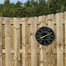 Load image into Gallery viewer, TR608 12" / 30 cm Neon Dial Weather Thermometer on fence