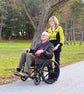 Woman pushing man in 56084 Wheelchair