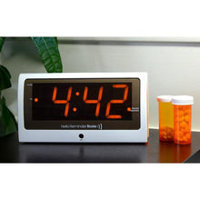Load image into Gallery viewer, LG604 Reminder Rosie Personalized Voice Alarm Clock on a side table
